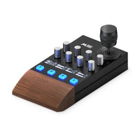 Middle Remote PTZ controller, three-quarter view: joystick, eight encoders, OLED displays and camera buttons 1 to 4